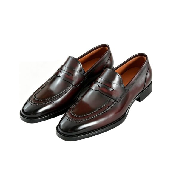 GRANDMARK patina penny loafer men's dress shoes, three-quarter view, white background