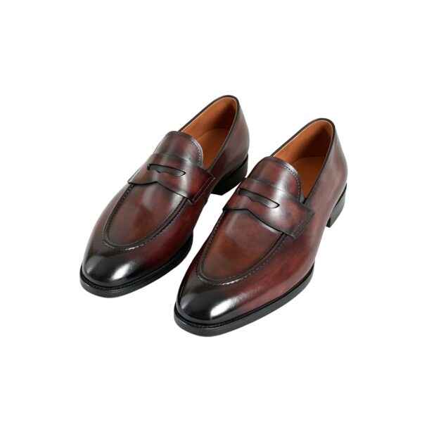 GRANDMARK round-toe penny loafer men's dress shoes, three-quarter view, white background