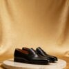 Brogue-Trim Penny Loafer men's formal leather dress shoe, GRANDMARK promotional photo