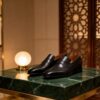 Brogue-Trim Penny Loafer men's formal leather dress shoe, GRANDMARK promotional photo